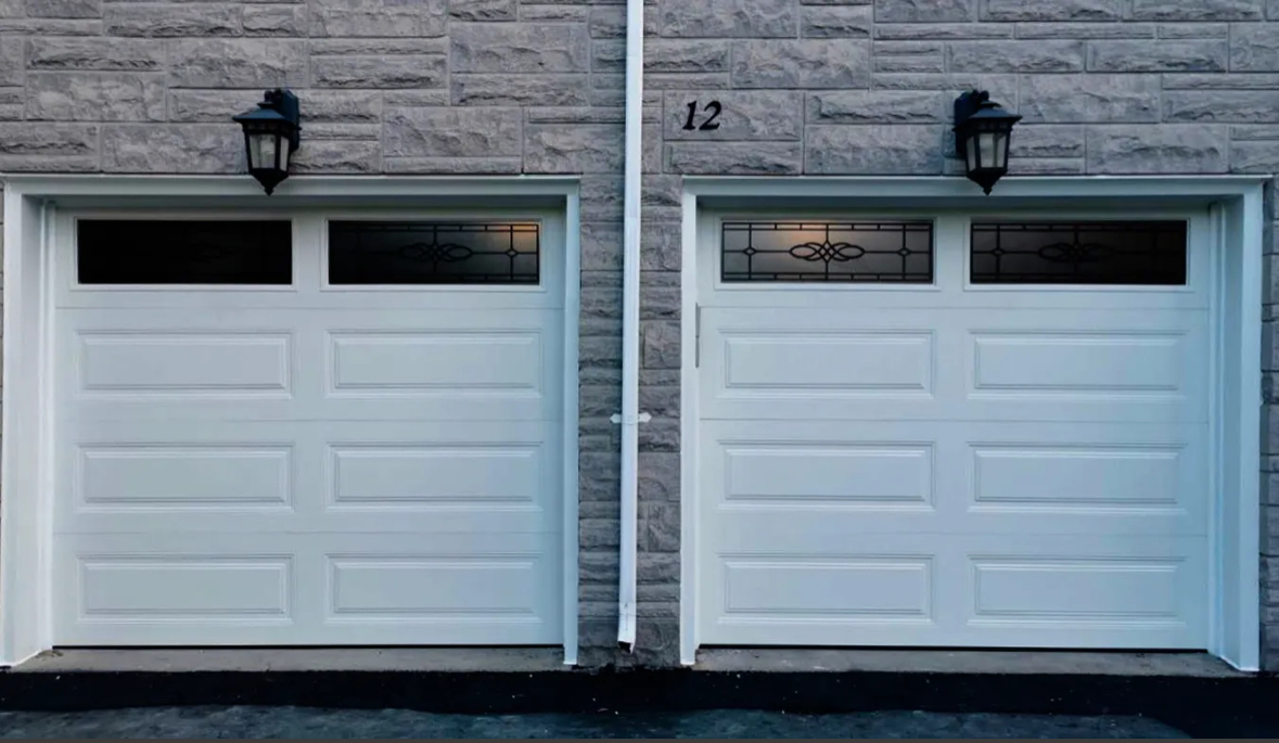White classic raised-panel garage doors with arched decorative windows
