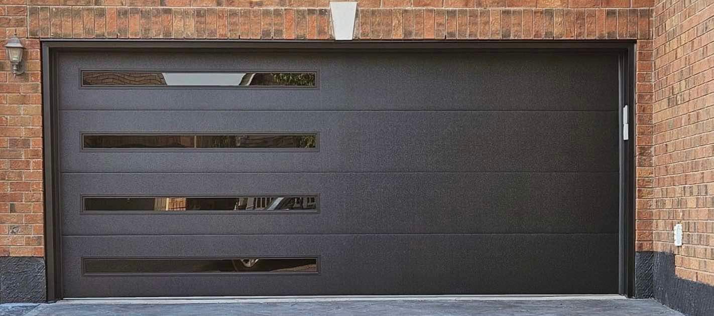 Dark modern flush garage door with horizontal window slats